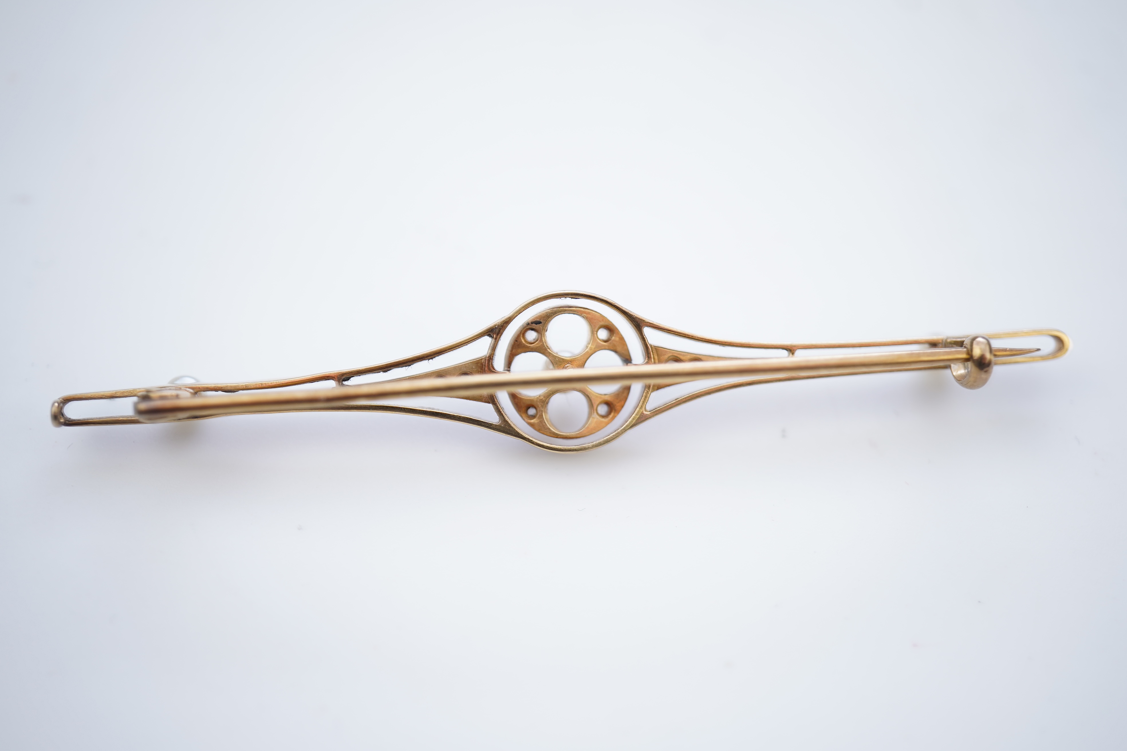 Four gold and gem-set bar brooches, early 20th century